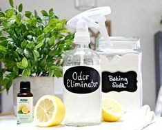 a bottle of cleaning solution sitting next to lemons