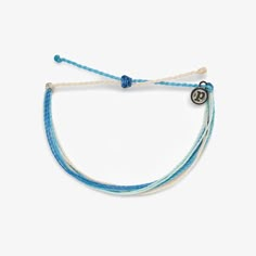 Introducing Spring Skies Bracelet, inspired by the soft hues of a clear spring day. Handcrafted with delicate shades of light blue and white, each piece embodies a sense of tranquility and freshness. Waterproof and meticulously made, reminiscent of endless blue skies. Embrace the Pura Vida vibes by securing yours today and let your style soar with the lightness of springtime.WaterproofGo surf, snowboard, or even take a shower with them on.Easily Adjustable One size fits all, easy to slip on and Cheap Blue Bracelets For Summer, Cheap Blue Beachy Bracelets, Cheap Light Blue Casual Bracelets, Affordable Blue Beachy Bracelets, Clear Spring, Bracelet Inspired, Preppy Jewelry, Shades Of Light Blue, Pura Vida Bracelets