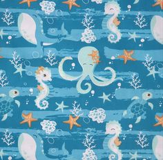 an octopus, starfish and other sea animals on blue fabric with white stars in the background