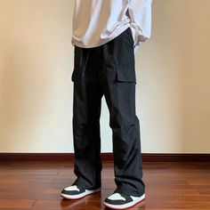 These men's drawstring cargo parachute pants are a blend of comfort and style. Made of polyester, they're durable yet lightweight. The drawstring at the waist and hem ensures a custom fit, while twin cargo side pockets offer practical storage space. With a mid-rise fit, they're ideal for any casual outing where comfort is key. Polyester Drawstring at waist & hem Twin cargo side pocket Mid rise Hip Hop Cargo Pants With Side Pockets For Outdoor, Techwear Pants With Drawstring For Streetwear, Techwear Pants For Streetwear With Drawstring, Techwear Drawstring Pants For Streetwear, Hip Hop Style Wide Leg Cargo Pants For Outdoor, Hip Hop Wide Leg Cargo Pants For Outdoor, Techwear Cargo Pants With Drawstring For Streetwear, Solid Cargo Pants With Functional Drawstring For Streetwear, Outdoor Straight Leg Sweatpants With Cargo Pockets