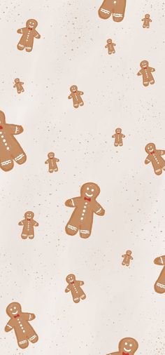 a group of gingerbread men on a white background with speckles and dots