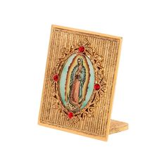 an image of the virgin mary with red stones on it's sides and gold frame