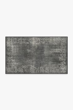 a gray rug with an ornate design on it