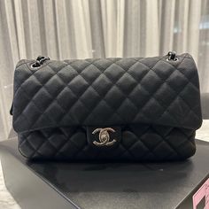 Chanel Single Flap Bag From The 2014 Cruise Collection. Interlocking Cc Logo, Caviar Leather, Quilted Pattern, Silver Hardware & Chain-Link & Leather Shoulder Straps, “Cc” Turn Lock Closure At Front, Zip Closure Beneath Front Flap, Grey Woven Canvas Lining & Single Pocket At Interior Wall W/ Zip Closure. Includes Original Box & Dust Bag. Chanel Authenticity Card With Serial Number. Used A Handful Of Times, Looks Brand New! Silver-Tone Hardware Chain-Link Shoulder Straps Bought At Saks In Greenwi Black Double Flap Bag For Business, Black Double Flap Business Bag, High-end Black Flap Bag With Dust Bag, Black Double Flap Bag With Removable Pouch, Black Double Flap Shoulder Bag, Chic Black Double Flap Bag, Designer Black Flap Bag With Chain Strap, Everyday Luxury Black Textured Leather Shoulder Bag, Black Textured Leather Shoulder Bag For Everyday Luxury