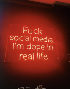 a neon sign that says flick social media, i'm dope in real life