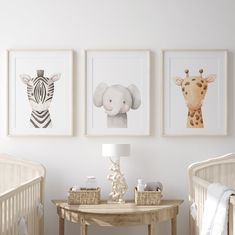 three framed pictures hang on the wall above a crib in a baby's room