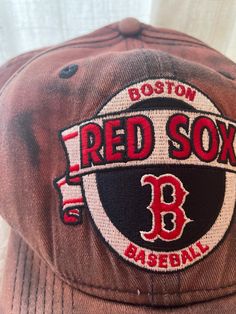 the boston red sox baseball cap is brown