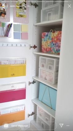 the closet is organized with plastic containers and file folders