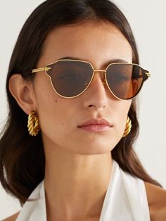 BOTTEGA VENETA EYEWEAR Glaze round-frame gold-tone sunglasses | NET-A-PORTER Bottega Veneta Sunglasses, Black Round Sunglasses, Designer Sunglasses For Women, Sunglasses Women Designer, Aviator Style, Fine Watches, Eyewear Womens, Gold Sunglasses, Sunglasses For Women