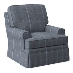 a chair that is sitting up against a white background and has a plaid pattern on it