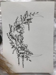 a black and white drawing of flowers in the shape of a half moon on paper