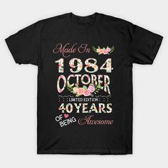 a black t - shirt that says made in 1994 and has flowers on the front