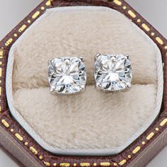 Earrings Information 
  


Metal: 
925 Sterling Silver 


SKU:
ACE-037/ACE-038 


Rhodium: 
Yes 


Nickle Free: 
Yes 


Gem Type: 
Moissanite


Stone Color: 
White


Stone Cut: 
Cushion Cut


Stone Total Weight:
1.0/2.0 CTTW.


Stone Setting:
Prong Setting


Average Clarity: 
FL-IF 


Average Color: 
D-E 



 




LOOKS THE SAME AS DIAMOND (WITH NAKED EYES)
While diamonds are graded on the 4 C’s scale (Cut, Clarity, Color, Carat), AINUOSHI Moissanite® are not diamond, and are graded solely on color. The cut and clarity are similar across different qualities.

Moissanite have higher dispersion and refractive index, and the result is that the fire color is better than diamonds. One good moissanite is almost perfect. AINUOSHI Moissanite® will bring you the best experience. Every AINUOSHI Mois Luxury Sterling Silver Brilliant Cut Earrings, Luxury Moissanite Diamond Earrings With Prong Setting, Luxury Sterling Silver Earrings With Stone Setting, Luxury White Moissanite Earrings, Luxury Moissanite Earrings With Prong Setting, Luxury Cushion Cut Earrings With Diamond Accents, Luxury Sterling Silver Diamond Cut Gemstones, Luxury Classic Cushion Cut Diamond Earrings, Luxury Cushion Cut Diamond Earrings With Prong Setting