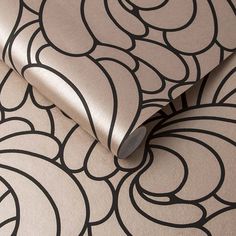 a close up view of a wallpaper with black and white swirls on it