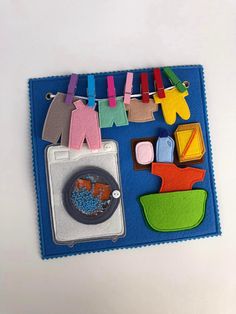 a felt board with clothes pins and magnets attached to it