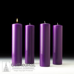 three purple candles sitting next to each other