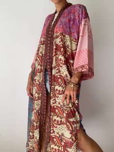 "This is one of a kind patchwork, upcycled silky robe Made free size with wrap tie closing and wide kimono sleeves Easy and fun to wear around the house or outside as a urban boho style, flowy kardigan with jeans and tshirt It is very comfy and feels soft and light the material is colourful and free flowing made into this unique stylish over all MEAESURE free size length 55\" MATERIAL *polyester *no lining Please visit also https://www.etsy.com/shop/AltheaStores CARE INSTRUCTIONS * Wash in warm Comfy House, House Night, Urban Boho, Beach Cardigan, Skirts Flowy, Silky Robe, Peasant Skirt, Flounce Skirt, Hippie Girl