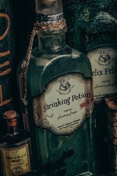 two bottles of ginking potton sitting next to each other on top of a shelf