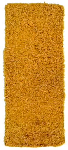 a yellow shaggy rug on a white background