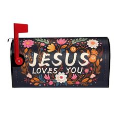 a mailbox with the words jesus loves you painted on it