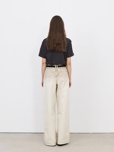 This is a minimal and feminine pants by MOHAN that is made out of high quality and sturdy fabric. With design detail that gives a trendy and refined mood, you can style it with various items for a clean daily outfit. - Mid low rise silhouette- YKK zipper and signature rivets detail- Leather patch on the back Chic Beige Tapered Leg Jeans, Chic Beige Jeans With Relaxed Fit, Trendy Neutral Bottoms For Everyday, Trendy Neutral Everyday Bottoms, Trendy Neutral Cotton Pants, Chic Cream Pants For Everyday, Everyday Beige Pants With Five Pockets, Beige Five Pocket Pants For Everyday, Trendy Cream Pants With Five Pockets