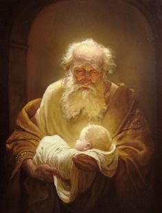 an old man holding a baby in his arms