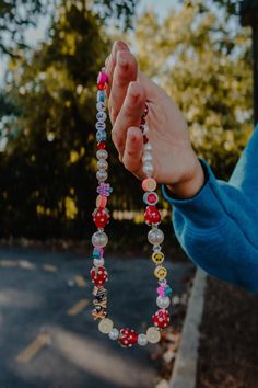 Cute beaded strawberry, pearl and clay fruit necklace. It is 16" long. Necklace is not meant to be worn in the shower or the pool. Please remove before getting wet. Fun Pink Beaded Necklaces With Letter Beads, Pink Letter Beads Fun Necklaces, Playful Red Jewelry With Letter Beads, Playful Red Beaded Jewelry, Recycled Costume, Necklace With Clay, Beaded Strawberry, Strawberry Beads, Clay Fruit