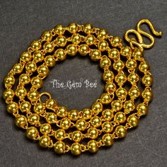 Thank you for coming in! Gorgeous 24K solid yellow gold necklace with old-fashioned plain balls and S hook clasp! One Spectacular necklace with exotic charm! Inside it has a '999' stamp mean gold content 99.9% AKA 24k solid gold. 19 inch length! You'll get the necklace you see! SIZE: 3.5mm diameter Weight: Appr. 14 grams MATERIAL: 24k Solid Yellow Gold Gold Necklaces With Polished Round Beads, Handmade Luxury Gold Beaded Necklaces, Luxury Gold Beaded Necklace With Polished Beads, Gold Necklace With Polished Beads For Formal Occasions, Luxury Handmade Gold Beaded Necklaces, Formal Gold Necklace With Polished Beads, Luxury Gold Necklaces With Polished Beads, Gold Single Strand Round Bead Necklaces, Gold Single Strand Round Bead Necklace