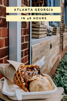 a white plate topped with waffles and ice cream on top of a wooden table