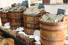 several wooden buckets filled with money on display