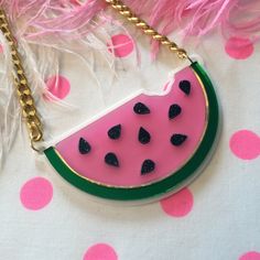 "This is a scrumptious necklace for all seasons! Bring the fun to any outfit with this big and bold watermelon necklace. This original design has been laser cut out of a mix of glitter, mirror, and opaque 1/8\" acrylic sheet and is backed with white, 1/16\" acrylic. The necklace hangs from a thick, gold chain and measures about 16\". We love these necklaces and think that they never get old. However, to prolong the life of yours, treat it with love! Be careful when storing it in a bag or pocket Deprivation Tank, Watermelon Necklace, Glitter Mirror, Thick Gold Chain, Sensory Deprivation, Funky Necklace, Acrylic Necklace, Watermelon Slice, Diy Storage Boxes