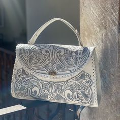 Hand Tooled Leather Bag, Hand Made In Leon, Guanajuato. Comes With A Long Strap So It Can Turn Into A Crossbody Hand Tooled Travel Clutch, Luxury Hand Tooled Satchel For Daily Use, Hand Tooled Top Handle Satchel, Hand Tooled Top Handle Shoulder Bag, Elegant Hand-tooled Top Handle Shoulder Bag, Elegant Leather Clutch With Hand Tooled Details, White Leather Clutch With Detachable Strap, Elegant Hand Tooled Satchel Shoulder Bag, Elegant Hand-tooled Satchel Shoulder Bag