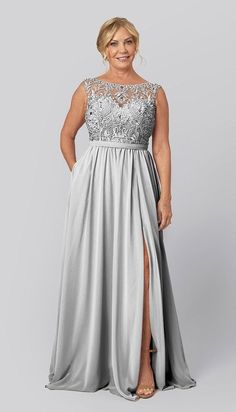 a woman in a long silver dress with a slit down the side and lace detailing on top