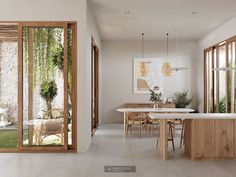 an open kitchen and dining area with sliding glass doors