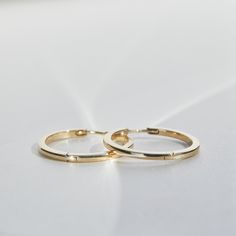 Simple, classic, well-made everyday hoops. Adds some polish and shine, with a nice clean line. Classic 14k Gold Hoop Earrings For Everyday, Classic 14k Gold Huggie Earrings, Timeless Polished Huggie Earrings For Formal Occasions, Timeless Polished Finish Huggie Earrings For Formal Occasions, Formal Classic Huggie Earrings With Polished Finish, Classic Polished Huggie Earrings For Formal Occasions, Classic Hoop Huggie Earrings For Everyday, Minimalist Polished Finish Huggie Earrings For Formal, Classic White Gold Huggie Earrings