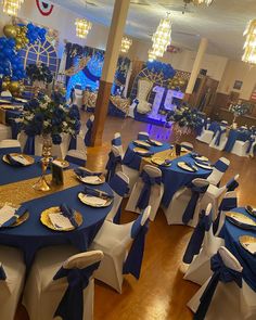 a banquet hall decorated with blue and gold decorations