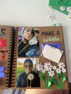 an open notebook with photos and flowers on it