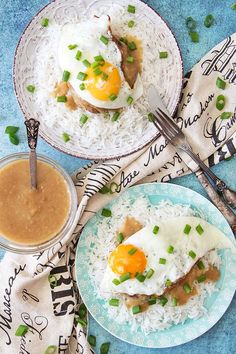 two plates filled with rice and topped with an egg