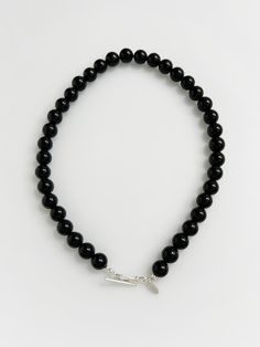 Unique and elegant accessories that will embellish your outfit - Simple, onyx stone necklace- Short length- Toggle clasp Elegant Single Strand Onyx Jewelry, Elegant Adjustable Onyx Necklace, Classic Onyx Jewelry With Gemstone Beads, Elegant Onyx Beaded Necklaces For Formal Occasions, Classic Onyx Round Beads Jewelry, Classic Onyx Round Bead Jewelry, Elegant Onyx Necklace With Polished Beads, Formal Onyx Round Bead Necklaces, Formal Onyx Necklace With Round Beads