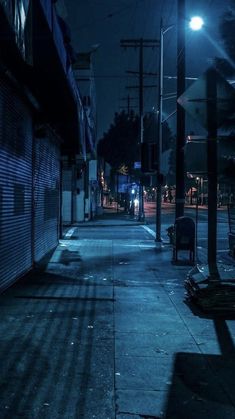 an empty city street at night with no one on it