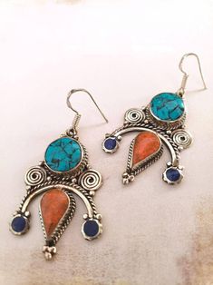 Turquoise and Coral Earrings - Tibetan Style Bohemian Turquoise Jewelry With Artistic Design, Handmade Turquoise Metal Earrings, Traditional Turquoise Earrings As A Gift, Blue Earrings With Intricate Design For Gift, Unique Turquoise Metal Earrings, Traditional Blue Earrings With Intricate Design, Turquoise Pierced Earrings For Festival, Festival Turquoise Metal Earrings, Handmade Turquoise Fusion Earrings