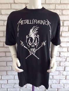 Vintage 1993-1994 Metallica tshirt with inscription Metalli'fukin'caPrinted front and back, super rare to findIn a good pre loved condition, however there is a few holes on one side at the bottomSize XL on tagPit to pit 22,83 inchesTotal length 29,13  inchesAs for all of my tee shirts, there's only one so take it or miss it :)Other model of Metallica shirt here : https://www.etsy.com/listing/561077409/metallica-vintage-1993-super-rare-reaper?ref=shop_home_active_1To enjoy exclusive updates on al Festival Streetwear Crew Neck T-shirt, Alternative Style T-shirt For Festival Streetwear, Festival Crew Neck T-shirt For Streetwear, Crew Neck T-shirt For Streetwear And Festivals, Grunge Deadstock T-shirt For Streetwear, Punk Style Festival T-shirt With Graphic Print, Punk Festival Graphic Print T-shirt, Punk Style Graphic Print Festival T-shirt, Punk Graphic Print T-shirt For Festivals