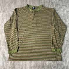 Vintage 90s Gap Basic Essential Striped Pattern Streetwear Skater Style 1990s Fashion Green Button Up Long Sleeve Shirt Large Mens Condition:  Fair Used Condition  = Holes And Staining throughout The Shirt Plus Distressing On The Sleeve Cuff Due To Age And Wear  Measurements: Please see photos above for all measurements IF YOU BUY TWO OR MORE ITEMS USE THE CODE BUNDLE @ CHECK TO SAVE 20% WE SHIP WITHIN 24 HOURS AFTER PURCHASE! Please be aware that we do not offer free returns!! The Buyer is resp Y2k Style Fall Tops With Buttons, Y2k Cotton Tops With Button Closure, Retro Button-up Top For Winter, Casual Long Sleeve Henley With Button Closure, Striped Crew Neck Top With Buttons, Retro Long Sleeve Shirt For Streetwear, Striped Long Sleeve Streetwear Shirt, Striped Long Sleeve Shirt For Streetwear, 90s Long Sleeve Tops For Fall