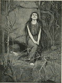 a woman sitting on top of a rock next to trees