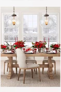 a dining room table set for christmas dinner