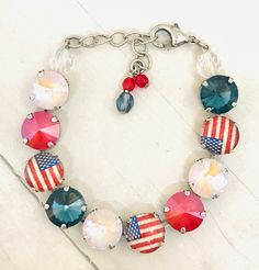 Patriotic Red White and Blue Austrian Crystal Bracelet, Patriotic Flag Crystal Bracelet, Patriotic Flag Statement Necklace, YOU CHOOSE METAL The sparkling patriotic Crystal Elements of denim blues, bright reds, and crystal beige make up the perfect Necklace, Bracelet and Earrings to wear any time of the year. The faceted crystals are brilliant and very rich while showing the red, beige, and blues of the Independence Flag. These jewelry pieces are sure to match many of your outfits. The necklace Red Round Beads Bracelets For 4th Of July, Patriotic Red Beaded Bracelets As Gift, Patriotic Red Adjustable Beaded Bracelet, Adjustable Red Beaded Bracelets For 4th Of July, Handmade Red Bracelet For 4th Of July, Red Jewelry For 4th Of July Party, Red Jewelry For Party On 4th Of July, Red Patriotic Jewelry For Independence Day, Red Patriotic Jewelry For Party