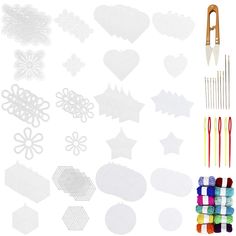 various crafting supplies including scissors, paper clips and thread spools on a white background