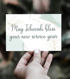 someone holding up a card that says may jehoah bless your new service year