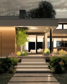 a modern house with steps leading to the front door