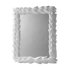 a white decorative mirror with wavy edges